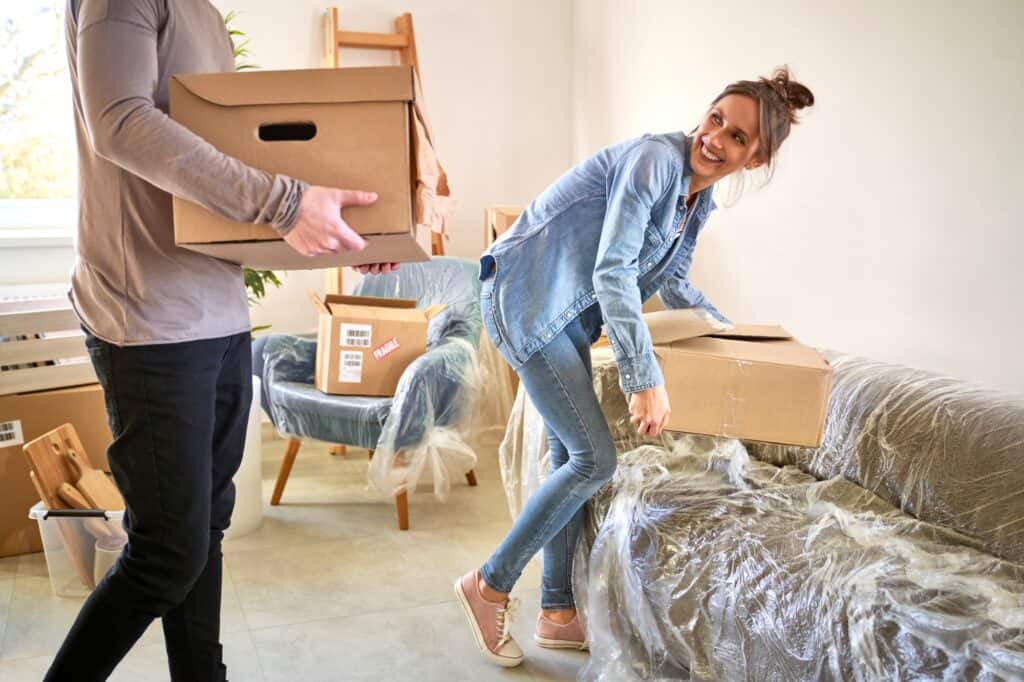 A couple in the process of packing household items